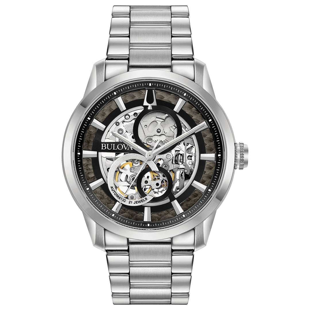 The Bulova Sutton Automatic 43mm Watch showcases a self-winding mechanism with a skeletonized black dial that displays its intricate gears, encased in a silver frame and paired with a stainless steel bracelet.