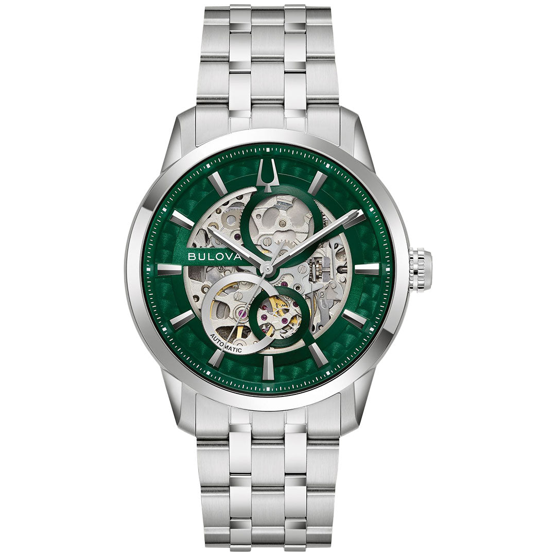 The Bulova Sutton Classic Automatic 40mm Watch features a stainless steel link band, green bezel, skeleton dial displaying the inner gears, and silver hour markers and hands.