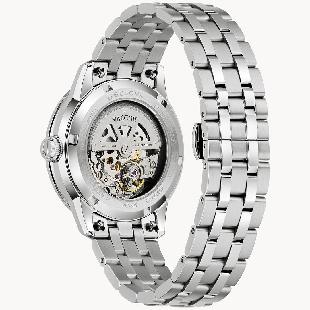 Close-up of the Bulova Sutton Classic Automatic 40mm Watch, highlighting its stainless steel bracelet and transparent case back that reveals the automatic movement and intricate internal mechanisms.