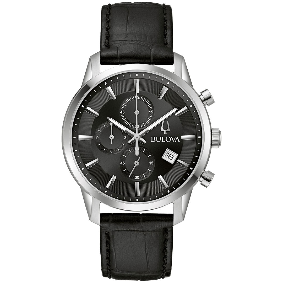 The Bulova Sutton Quartz 41mm men’s watch features a black leather strap, black dial with silver hour markers, three subdials, date window at 4 o’clock, and a silver-tone stainless steel case with chronograph buttons.