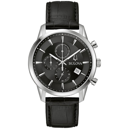 The Bulova Sutton Quartz 41mm men’s watch features a black leather strap, black dial with silver hour markers, three subdials, date window at 4 o’clock, and a silver-tone stainless steel case with chronograph buttons.