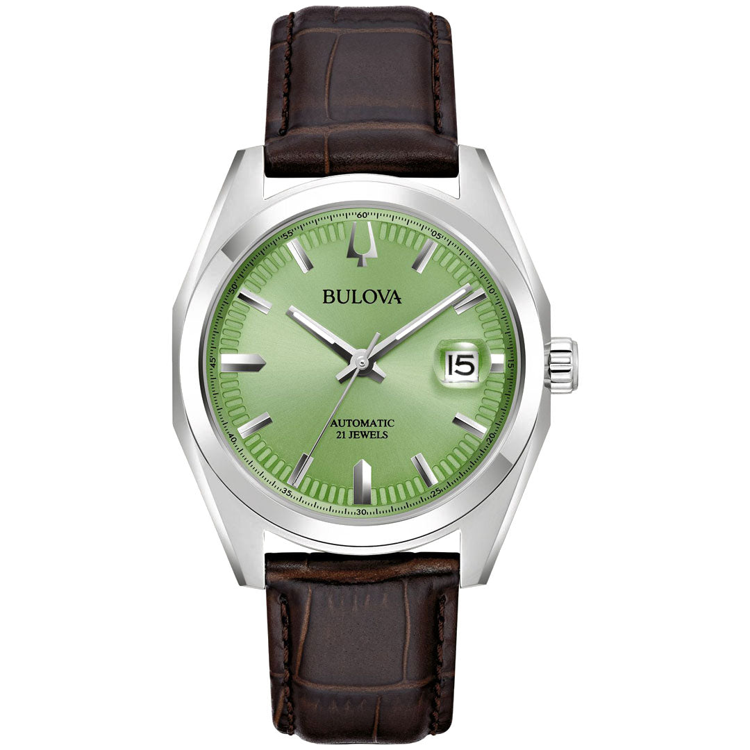 The Bulova Surveyor Automatic 39mm Watch is a stylish timepiece featuring a silver automatic design with 21 jewels, a green face, hour markers, and a date window at 3 o'clock. It boasts a stainless steel case and brown leather strap for classic elegance.