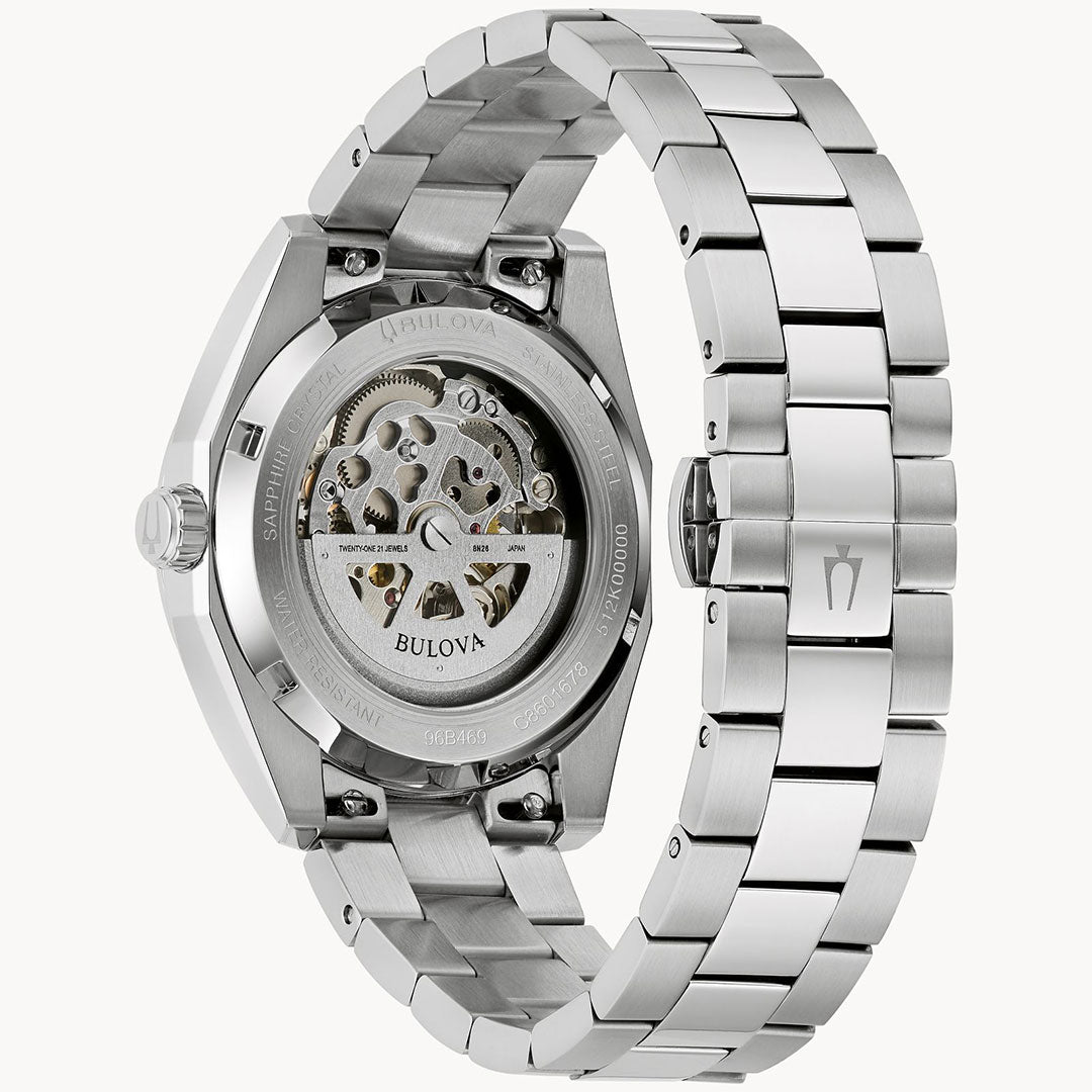 The back view of the Bulova Surveyor Automatic 39mm Watch features a stainless steel bracelet and a transparent caseback, showcasing the intricate automatic movement inside.