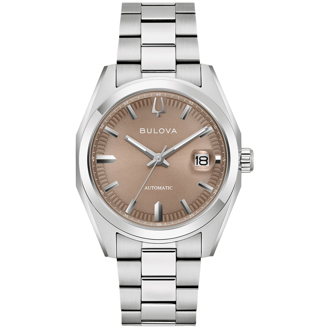 The Bulova Surveyor Automatic 39mm Watch is a silver men’s timepiece with a stainless steel bracelet, automatic movement, champagne dial, silver hour markers, and a date window at 3 o’clock.