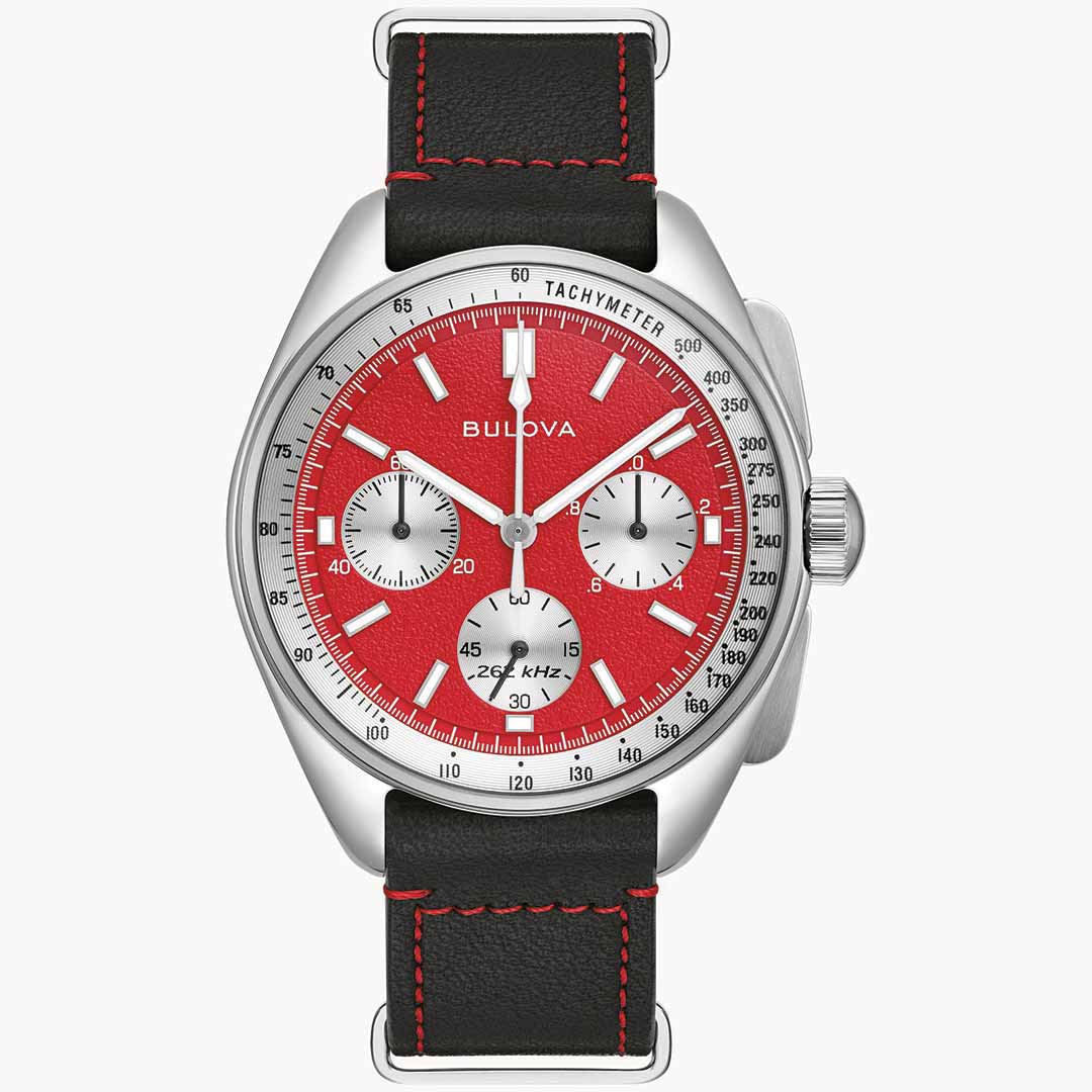 The Bulova Lunar Pilot Quartz 43.5mm Watch by Bulova features a striking red dial with three sub-dials and a tachymeter scale. It is enhanced with high-precision quartz movement, featuring a black leather strap accented with red stitching. The silver case includes visible pushers and crown for a modern look.