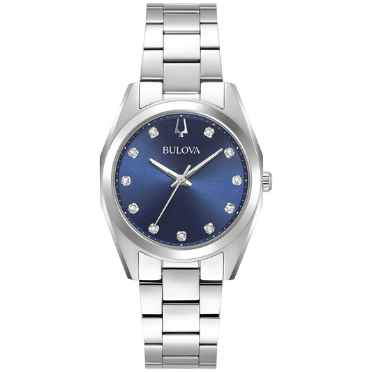 The Bulova Surveyor Quartz 31mm women's watch features a stainless steel band and a blue dial with diamond-like hour markers and silver hands. The Bulova logo is prominently placed under the 12 o'clock position, adding to the timeless elegance of its sleek and luxurious design.