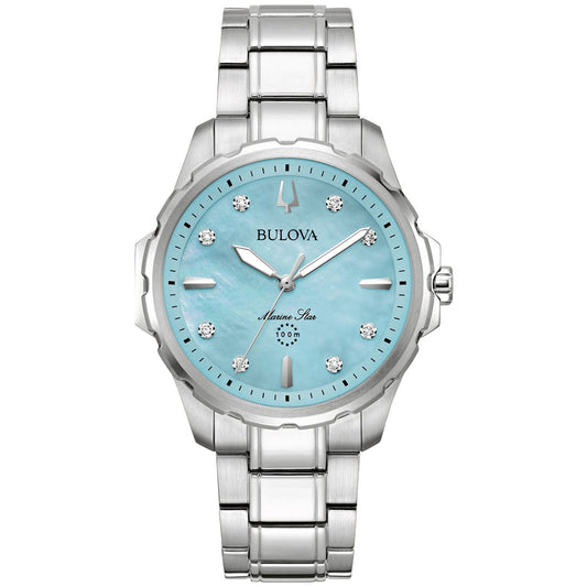 The women's timepiece, the Bulova Marine Star Quartz 36mm Watch by Bulova, features a silver metal band and a light blue mother-of-pearl dial. It includes silver hour markers, diamond accents, and a date window. With water resistance up to 100 meters, it offers both elegance and functionality for any occasion.