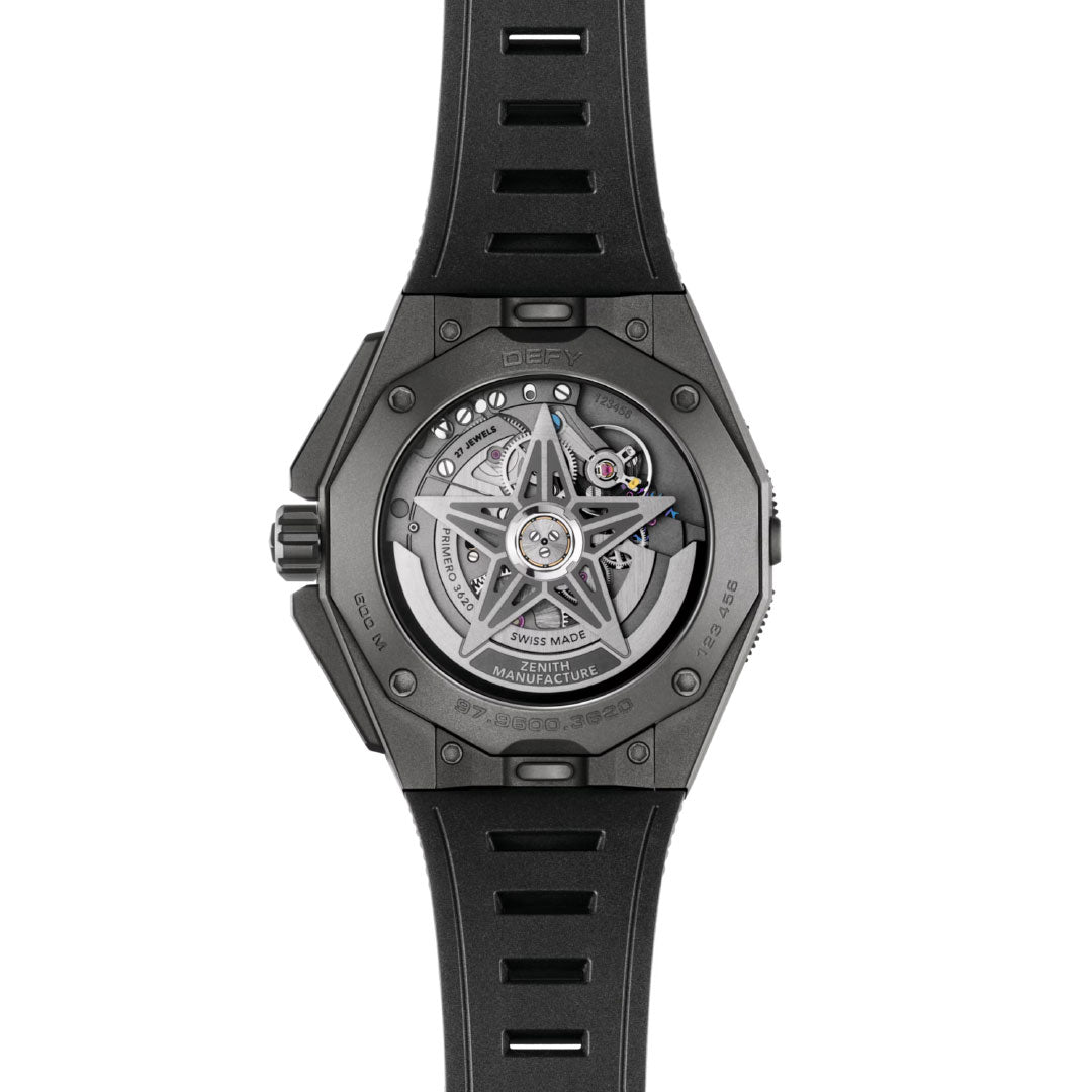 A close-up of the Zenith Defy Extreme Diver El Primero 3620 43mm watch shows its black strap and transparent case back, revealing the intricate mechanical movement and gears, emphasizing its impressive water resistance.