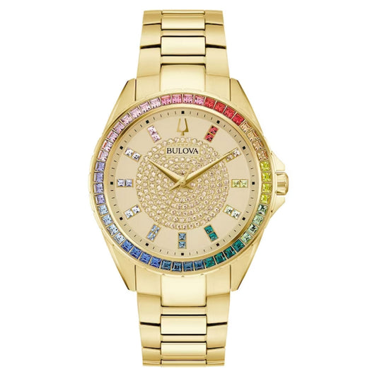 Experience ultimate sophistication with the Bulova Phantom Quartz 40mm Watch, a distinguished piece from Bulova. This timepiece showcases a luxurious gold-tone stainless steel bracelet and a vibrant gemstone bezel. Its face is adorned with stones arranged in concentric circles, complemented by multicolored rectangular hour markers.