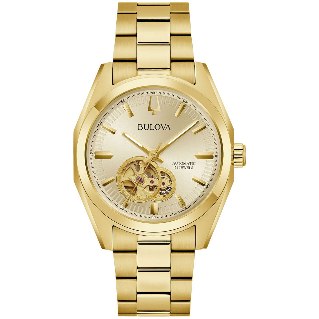 The Bulova Surveyor Automatic 39mm Watch artfully blends elegance and functionality with its automatic 21-jewel movement and visually striking visible gears section. The golden dial, adorned with bold hour markers, is harmoniously matched with a gold-tone stainless steel bracelet, while the brand name "Bulova" is elegantly displayed on the face.