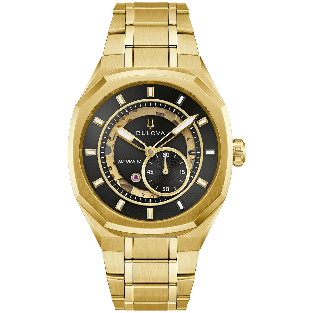 The Bulova Surveyor Marc Anthony Automatic 40.5mm Watch is a gold-tone stainless steel men’s timepiece featuring a black dial with gold hour markers and a small seconds subdial. This refined watch includes a metal link bracelet and displays its automatic movement, combining classic elegance with modern craftsmanship.