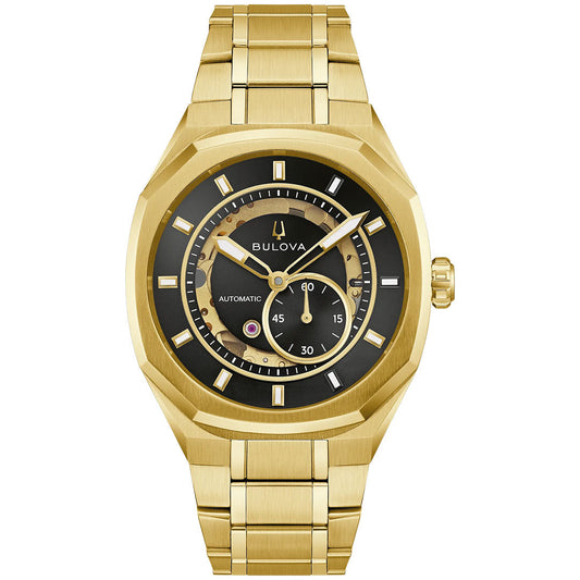 The Bulova Surveyor Marc Anthony Automatic 40.5mm Watch is a gold-tone stainless steel men’s timepiece featuring a black dial with gold hour markers and a small seconds subdial. This refined watch includes a metal link bracelet and displays its automatic movement, combining classic elegance with modern craftsmanship.