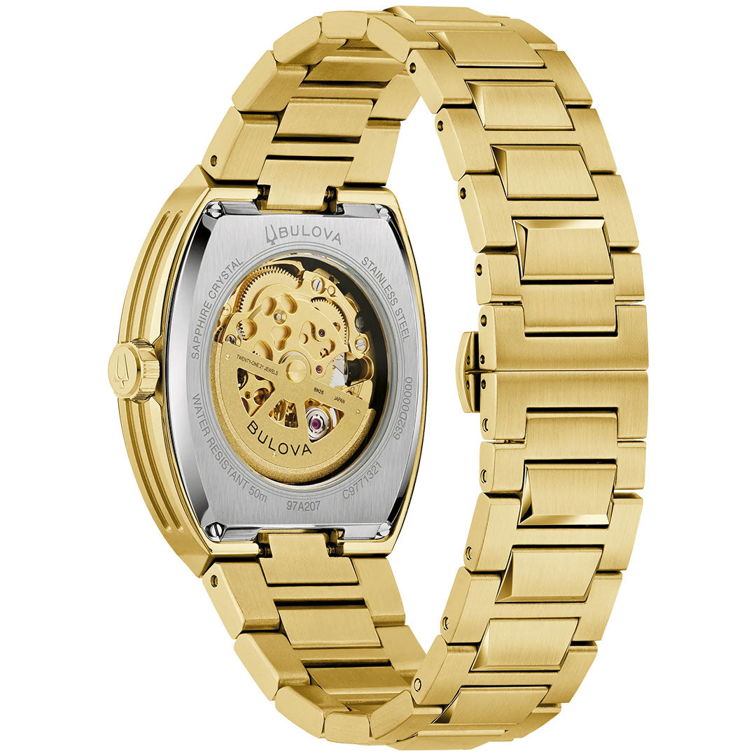 The Bulova Maquina Automatic 40mm men’s watch features a gold-tone stainless steel link band and a transparent caseback that reveals its inner mechanical movement, with engraved details surrounding the automatic skeleton design.