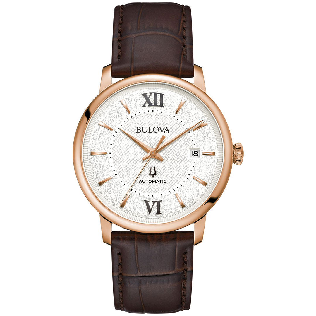 The Bulova Hudson Automatic 39mm Watch embodies sophistication with its white textured dial accentuated by a rose gold-tone stainless steel case. It is equipped with a brown leather strap, Roman numerals at 12, 6, and 9 o'clock, dot markers, and a date window positioned at 3 o'clock—making it an ageless dress watch suitable for any occasion.