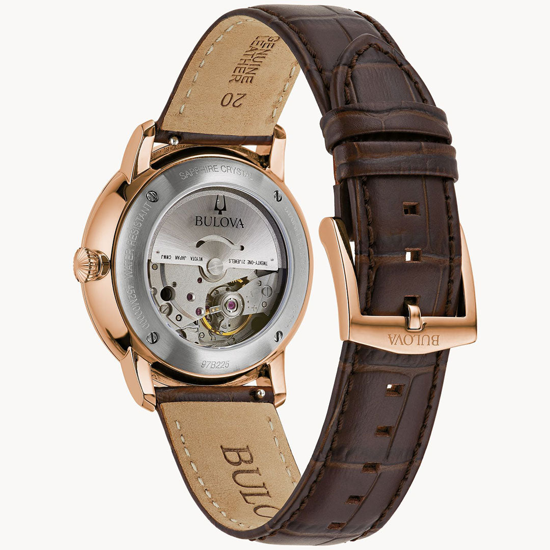 The Bulova Hudson Automatic 39mm Watch combines elegance and functionality with its brown leather strap, rose gold-tone stainless steel case, and sapphire crystal. Its open case back reveals the intricate inner mechanisms, showcasing the craftsmanship behind this exquisite timepiece from Bulova.