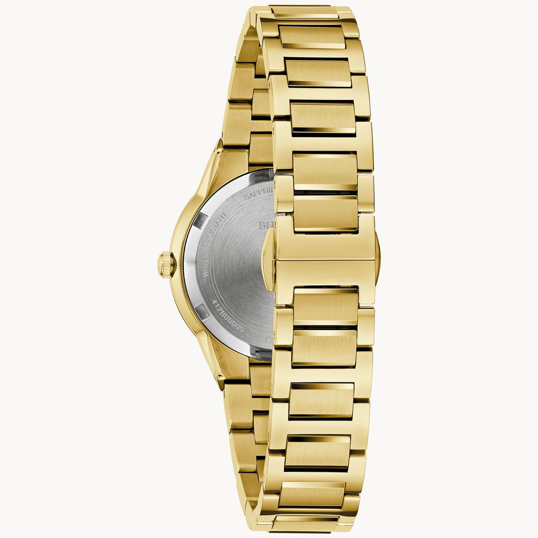 The Bulova Millennia Quartz 32mm Watch showcases a ladies' timepiece with a luxurious gold-tone stainless steel link band, viewed from the back. The watch's round case is complemented by a silver-colored back cover. Its closed clasp accentuates the sleek and modern design along with the polished links of the band, embodying sophistication and elegance.