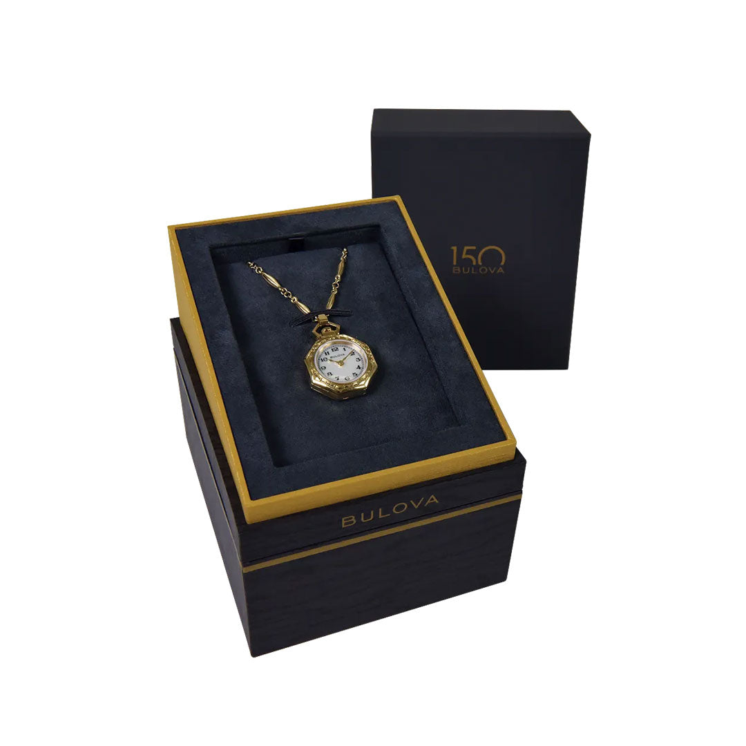 A Bulova 150th Anniversary Rubaiyat Quartz Necklace Pendant 25.5mm watch is shown in a black and gold box with "150 Bulova" on the inner lid, alongside another black box in the background.