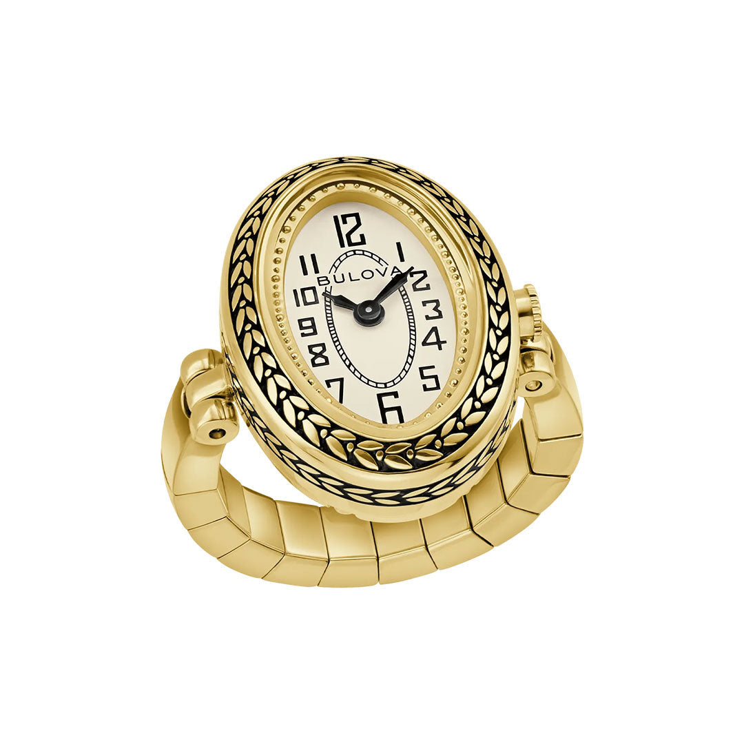 The Bulova Ring Quartz 17mm Watch is a vintage gold-tone ladies’ piece with an oval face, black Arabic numerals, decorative bezel, and a flexible coiled band. The hands display 10:09. Brand: Bulova.