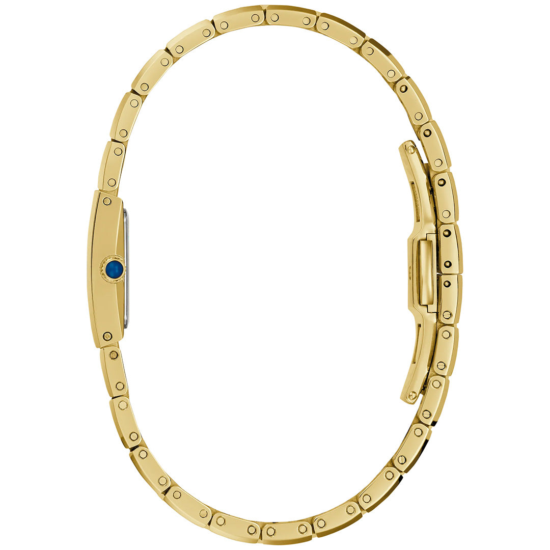 A Bulova Marc Anthony Harmony Quartz 14mm women’s watch, crafted in gold-tone stainless steel, is displayed from the side with its band elegantly open in an oval shape to showcase the bracelet links and clasp. This sophisticated piece features a blue gemstone accent on the side, and is presented without revealing the watch face.