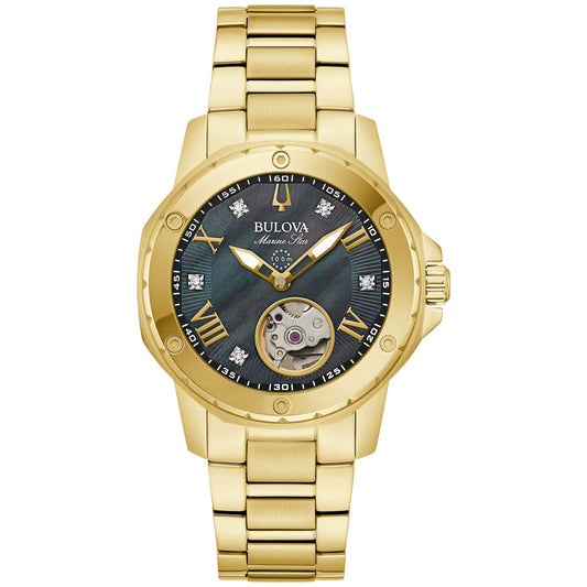 The Bulova Marine Star Automatic 35mm Watch is a stunning gold-tone stainless steel wristwatch featuring a metal bracelet and an elegant black face. It showcases Roman numerals, diamond markers, and an open heart display that reveals the watch's intricate mechanism. The brand name "Bulova" is elegantly displayed on the face.