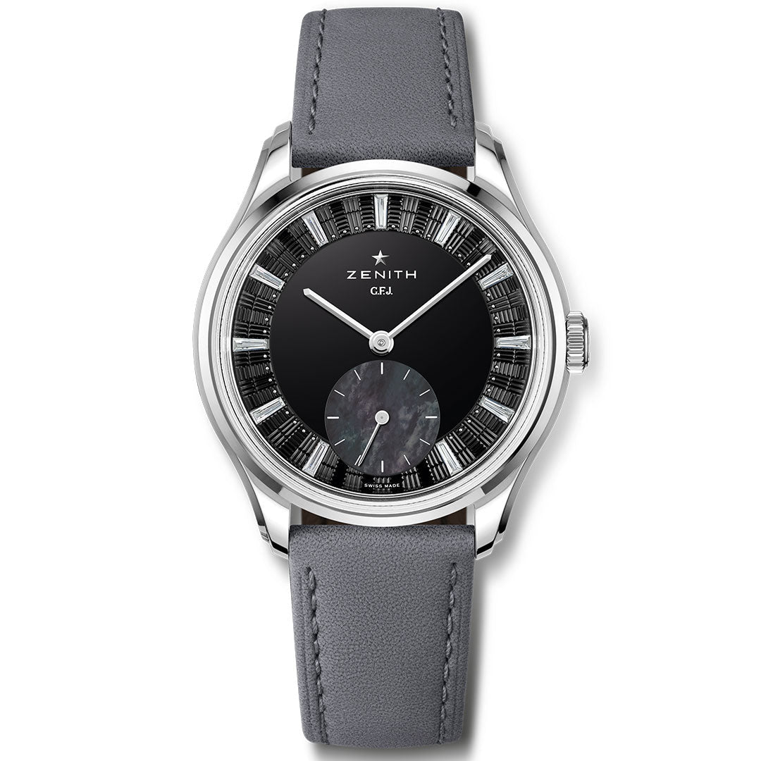 The Zenith G.F.J. Tantalum Calibre 135 Automatic 39.15mm watch features a black and silver dial, silver hour markers, small seconds subdial, grey leather strap, and the acclaimed Calibre 135 movement under the Zenith logo.
