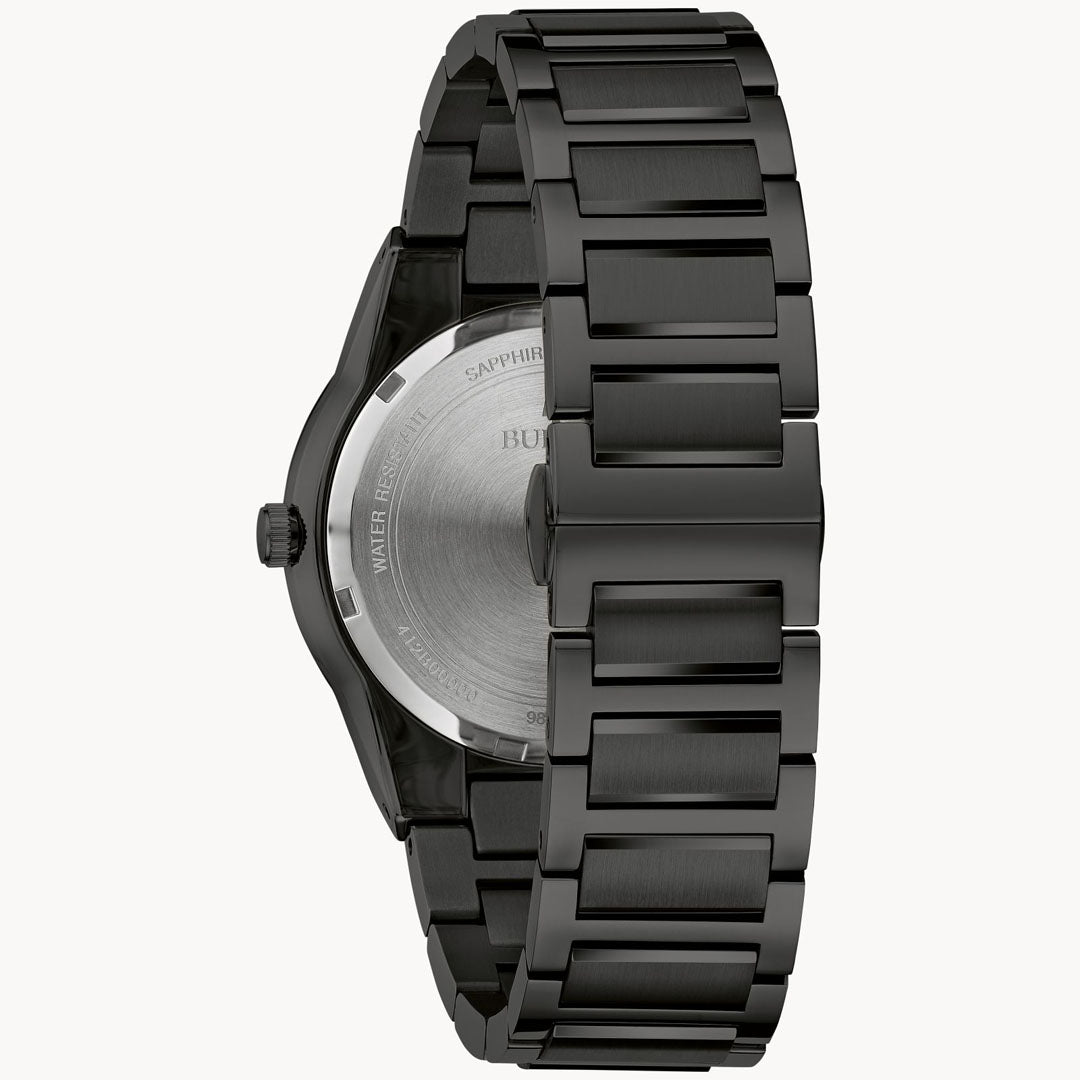 The Bulova Millennia Black Quartz 41mm Watch, a sleek stainless steel wristwatch with an IP black finish and round face, is viewed from the back. Its bracelet boasts polished links that highlight its contemporary design, and the engraving on the back of this Bulova men's timepiece is partially visible.