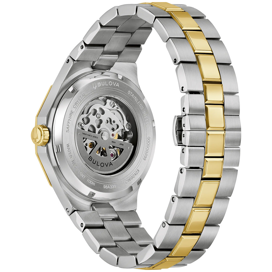 Back view of the Bulova Prestige Automatic 42mm Watch, showcasing a stainless steel and gold-tone bracelet, with its automatic movement visible through a transparent case back and protected by durable sapphire crystal.
