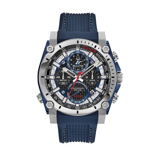 The Bulova Precisionist HPQ Quartz 46.5mm Watch features a sophisticated blue and silver design, adorned with multiple dials and red accents, along with the distinctive Bulova logo. Its strap showcases a textured blue pattern and is complemented by durable stainless steel construction.