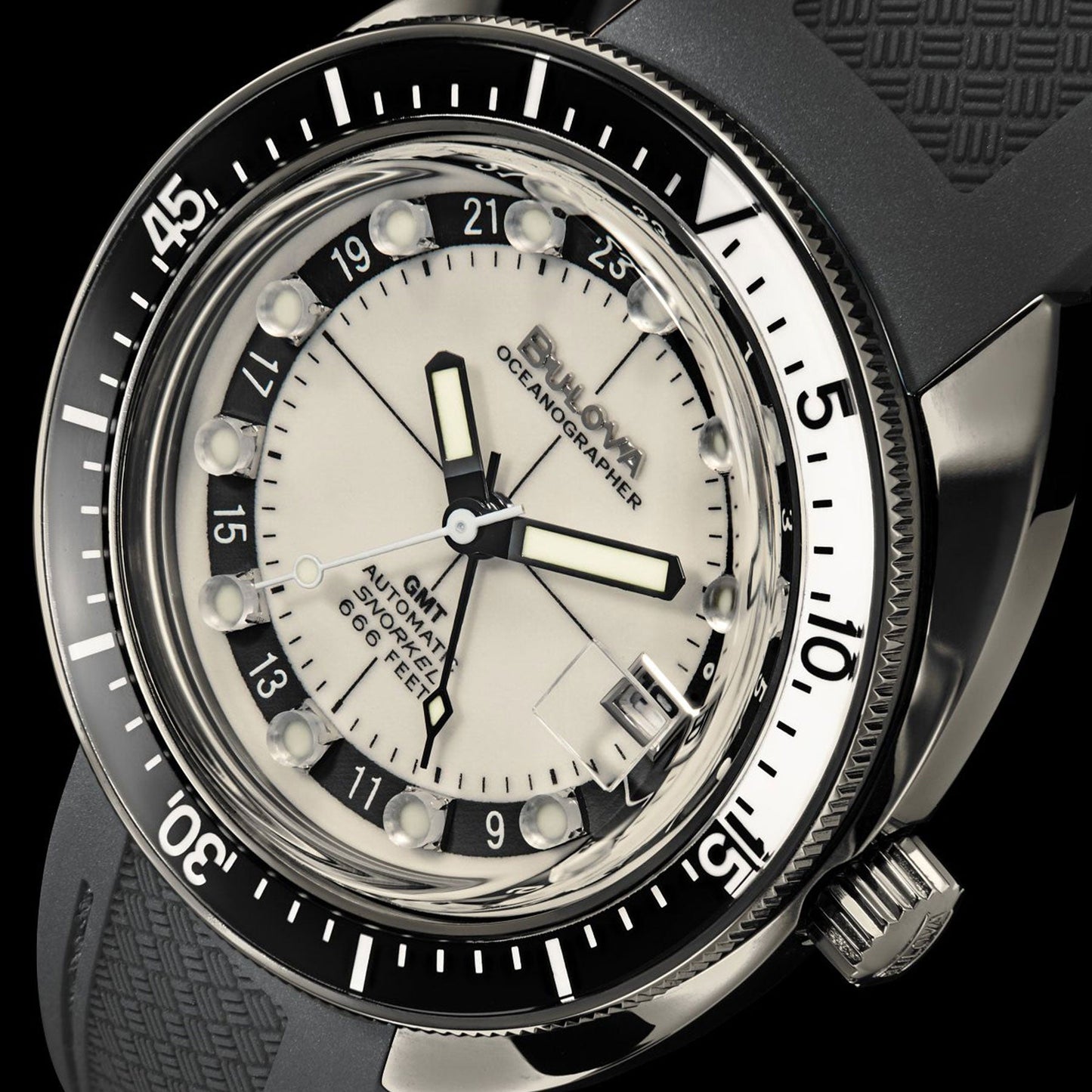 Here's a revised version of the sentence:

Close-up of the Bulova Oceanographer Automatic GMT 41mm Watch, showcasing its black and silver bezel, white dial, and black rubber strap. The dial features bold black hour markers and hands, with "Oceanographer 1000 Metres" displayed prominently. A prominent crown is positioned on the right side, powered by a self-winding GMT movement.