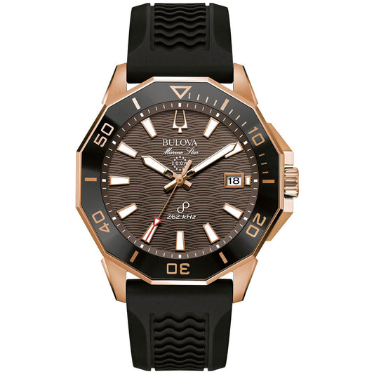 The Bulova Marine Star Quartz 43mm Watch by Bulova is a sporty timepiece featuring a black rubber strap and rose gold-tone stainless steel casing. It has a black bezel and a brown dial with wave patterns, luminous hour markers and hands, a date window at 3 o'clock, and the brand name positioned at 12 o'clock.