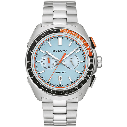 The Bulova Racer Quartz 42mm Watch in silver showcases a light blue dial with a tachymeter, two sub-dials, and an orange accent on the bezel. This stainless steel chronograph includes a date display at 6 o'clock and features a sleek silver metal link band.