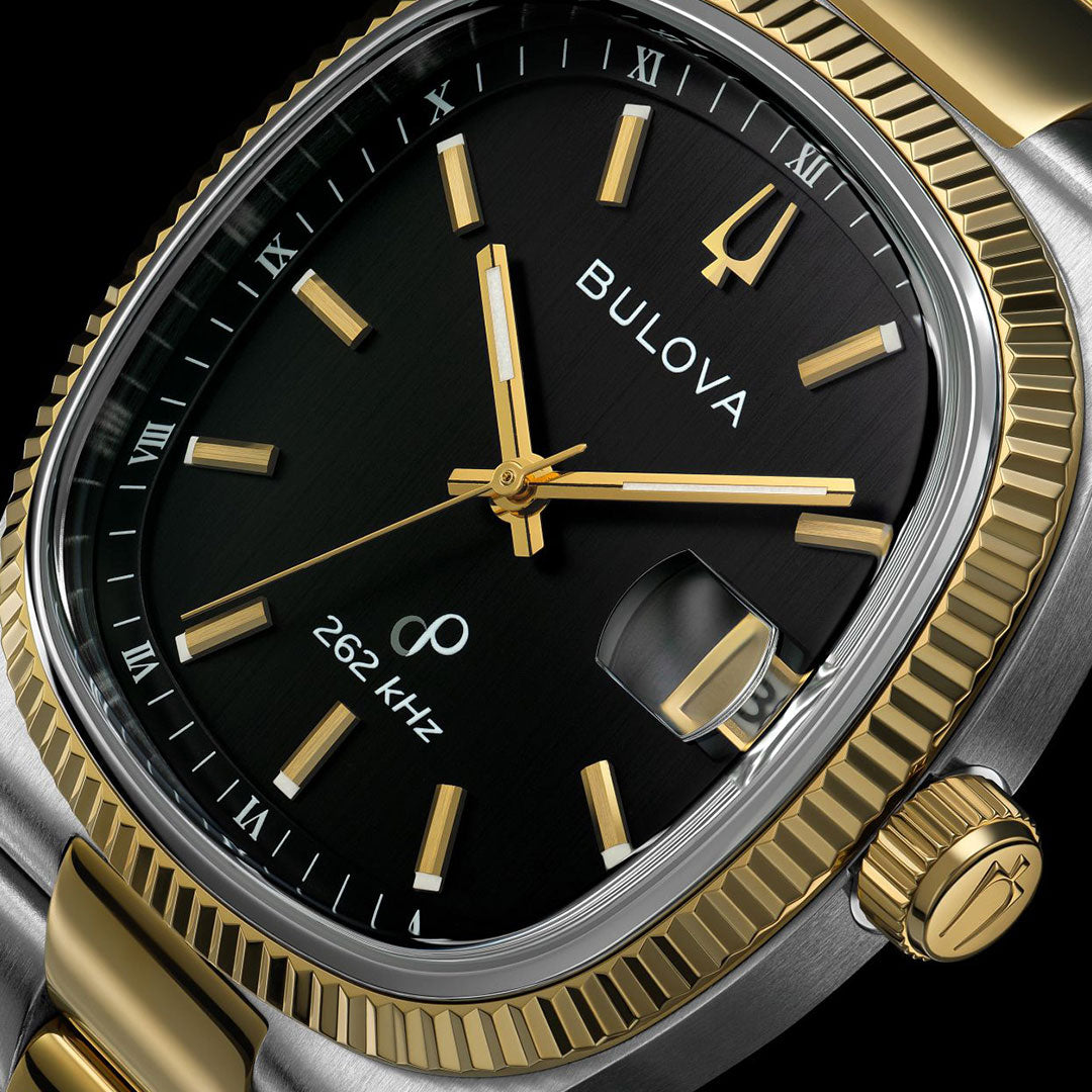 Close-up of a Bulova Super Seville HPQ Precisionist Quartz 37.5mm men’s watch featuring a black dial, gold hour markers and hands, dual-tone bezel, Roman numeral edge, date window, and "262 kHz" marking indicating its Precisionist movement.