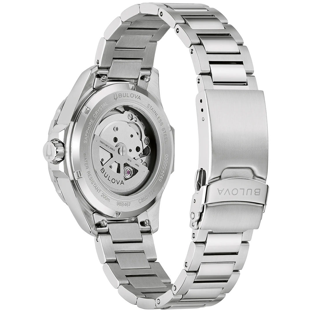 A close-up of the Bulova Marine Star Series B Automatic 41mm Watch highlights its stainless steel bracelet and case back, revealing the automatic movement and engraved Bulova details.