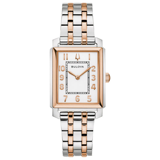 The Bulova Sutton Quartz 25mm women's watch features a rectangular case, two-tone silver and rose gold stainless steel band, white dial with rose gold numbers, and matching rose gold bezel.