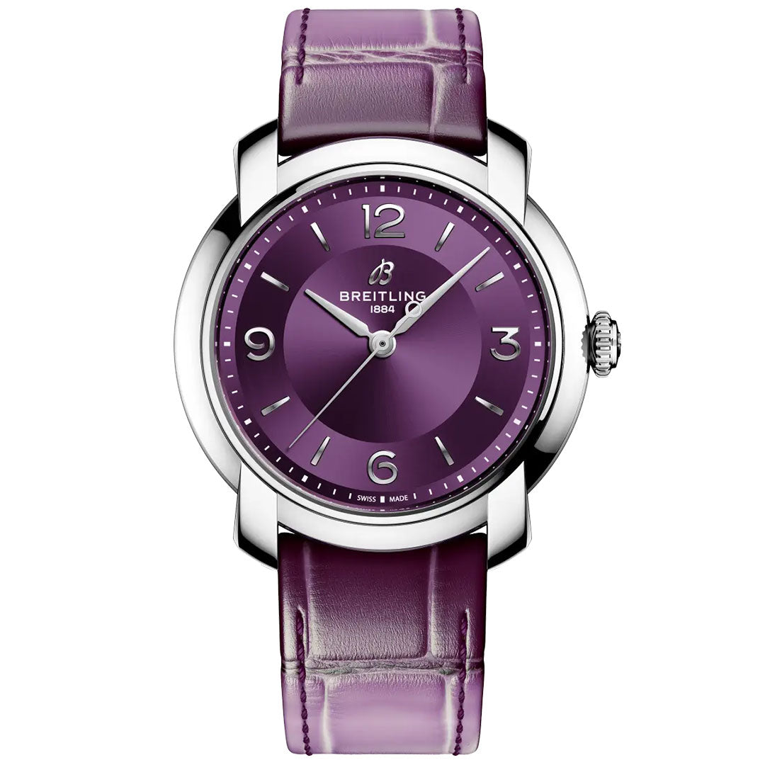 The BREITLING Lady Premier Automatic 36 is a stylish women’s chronograph with a purple dial, silver hour markers, and a matching purple leather strap in a polished silver case.
