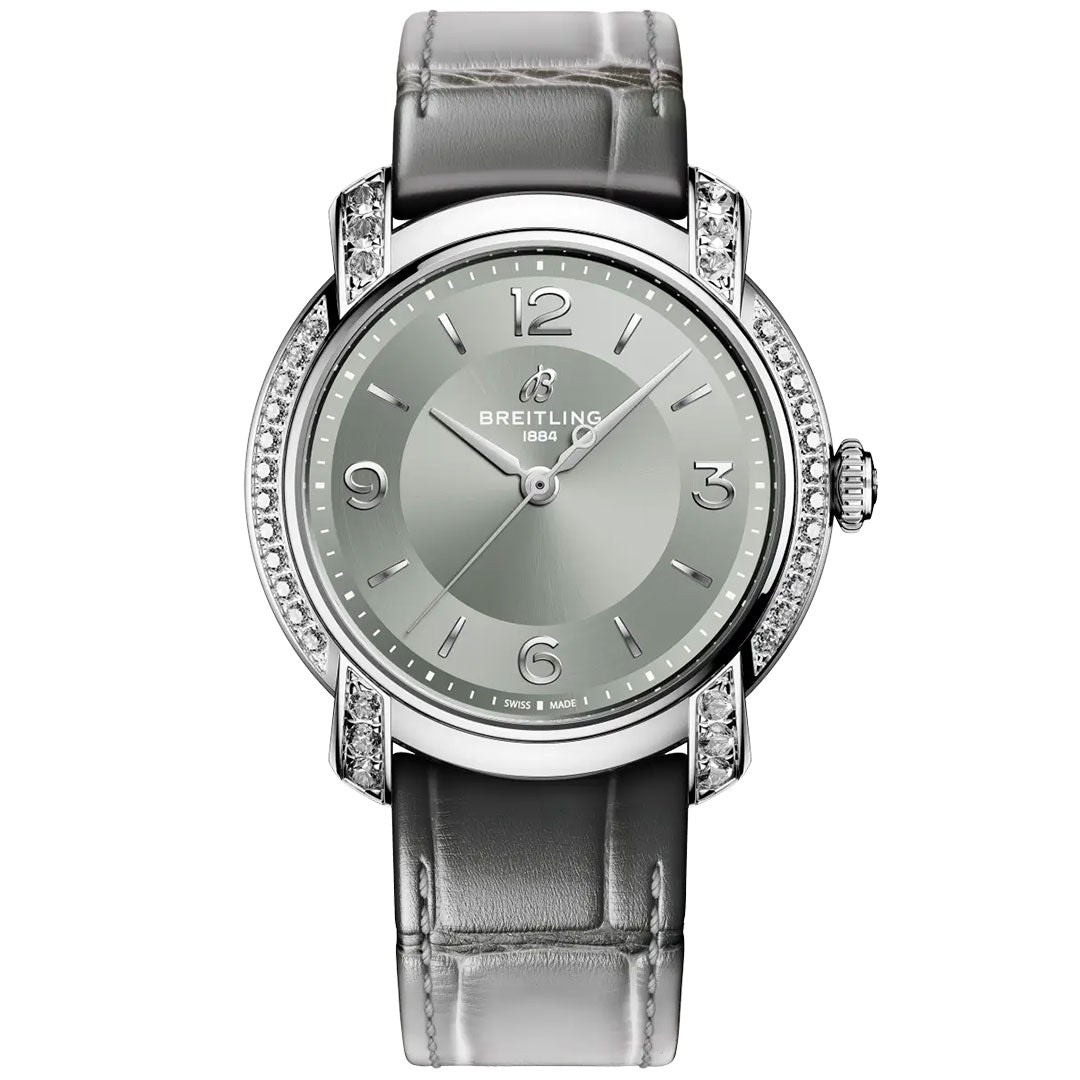 The BREITLING Lady Premier Automatic 36 by Breitling features a silver case, grey leather strap, diamond-accented bezel, and minimalist dial with silver markers—an elegant automatic watch for refined style.