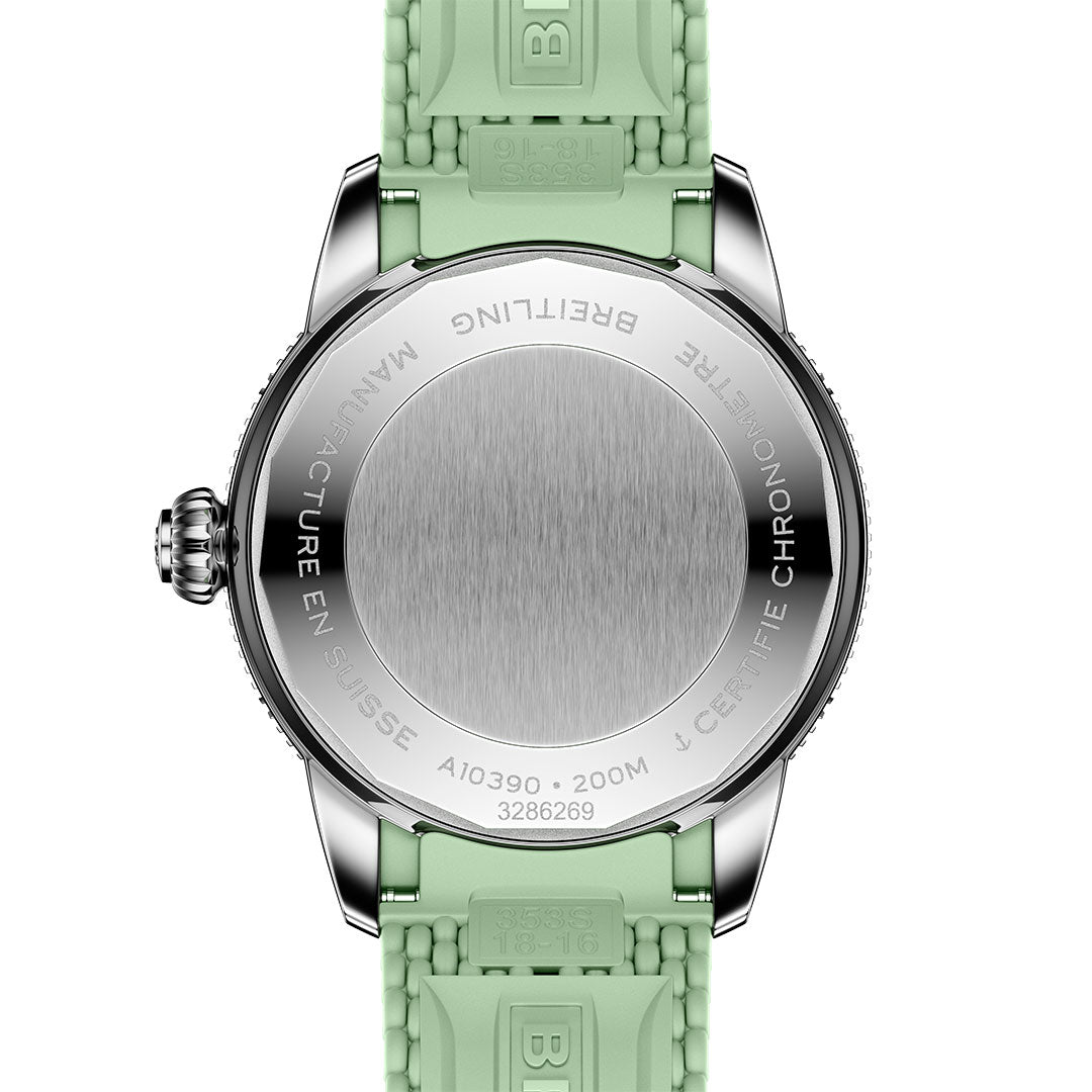 The back of the BREITLING Superocean Heritage B31 Automatic 36 shows engraved watch specs and certification, paired with a mint green textured rubber strap on this silver Breitling dive watch.