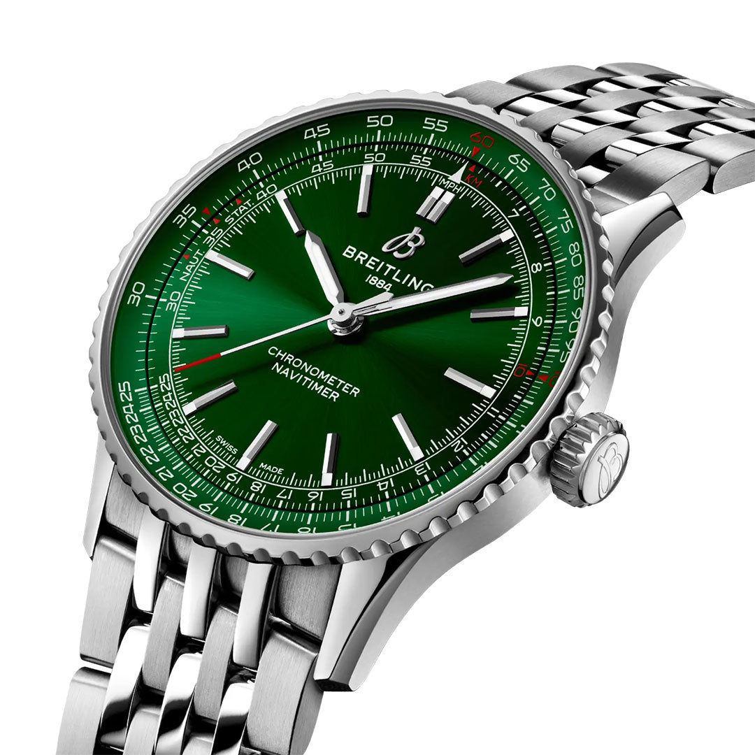 The Breitling Navitimer Automatic 41 features a green dial, silver hour markers and hands, and a stainless steel bracelet, displayed at an angle against a white background.