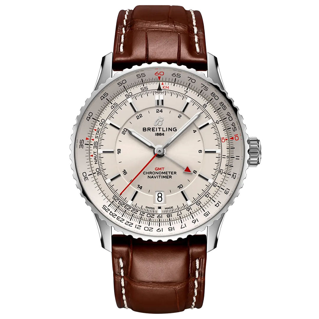 The BREITLING Navitimer Automatic GMT 41 by Breitling features a silver dial with red accents, multiple scales, chronometer markings, automatic GMT function, a silver bezel, and a brown leather strap; the display shows 10:10.