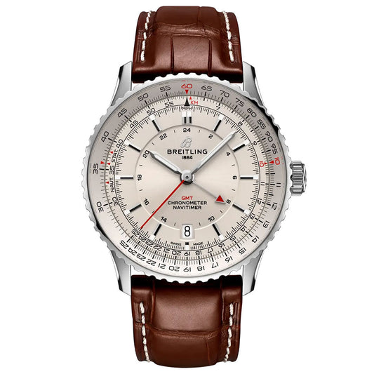 The BREITLING Navitimer Automatic GMT 41 by Breitling features a silver dial with red accents, multiple scales, chronometer markings, automatic GMT function, a silver bezel, and a brown leather strap; the display shows 10:10.