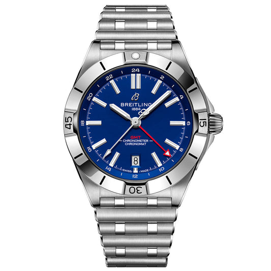 The BREITLING Chronomat Automatic GMT 40 features a stainless steel case, blue dial, silver hour markers, date window at 6 o'clock, red-tipped GMT hand, metal bracelet, and rotating bezel.