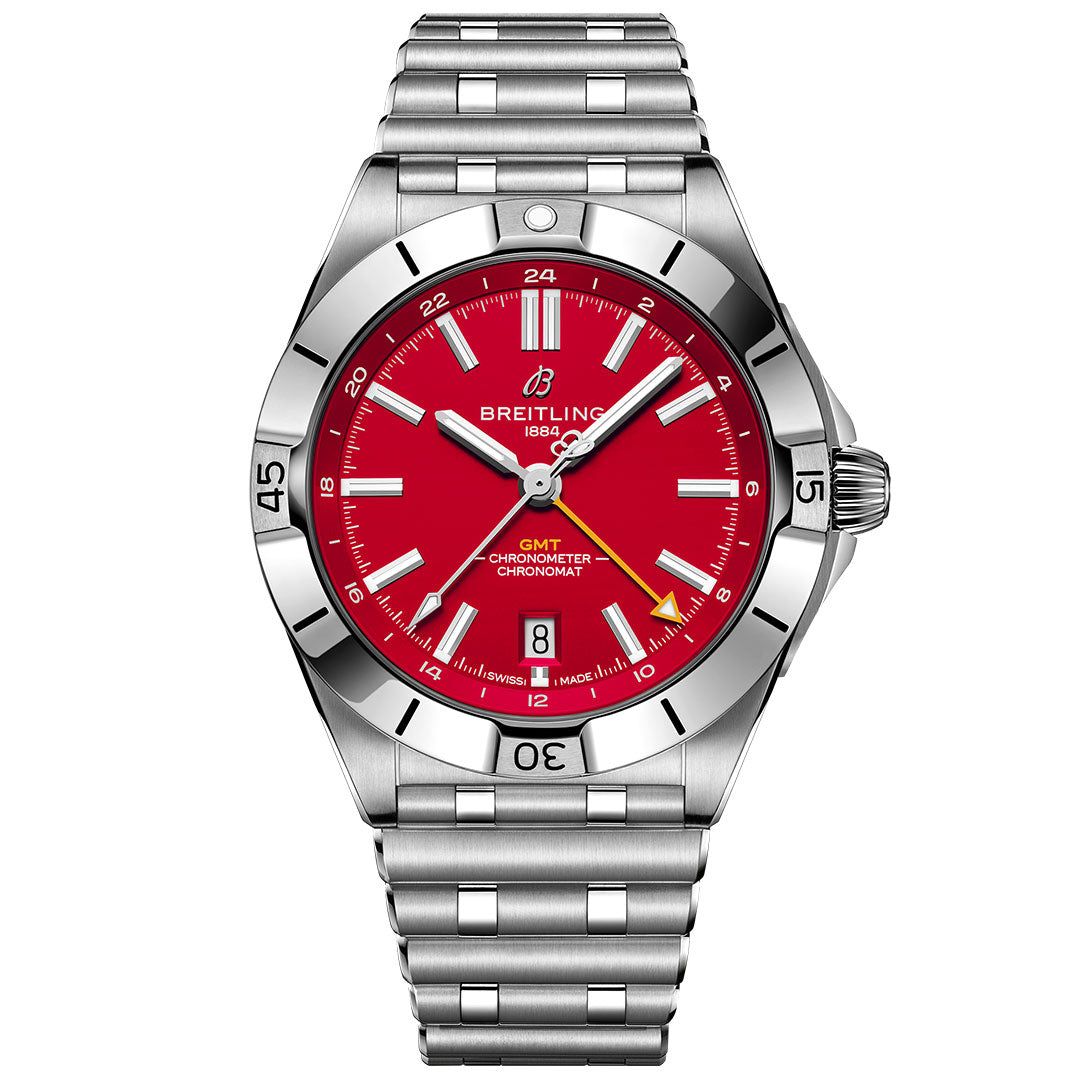 The BREITLING Chronomat Automatic GMT 40 features a stainless steel case, bright red dial, silver hour markers, date window at 6 o’clock, metal link bracelet, and a bezel with minute indicators.