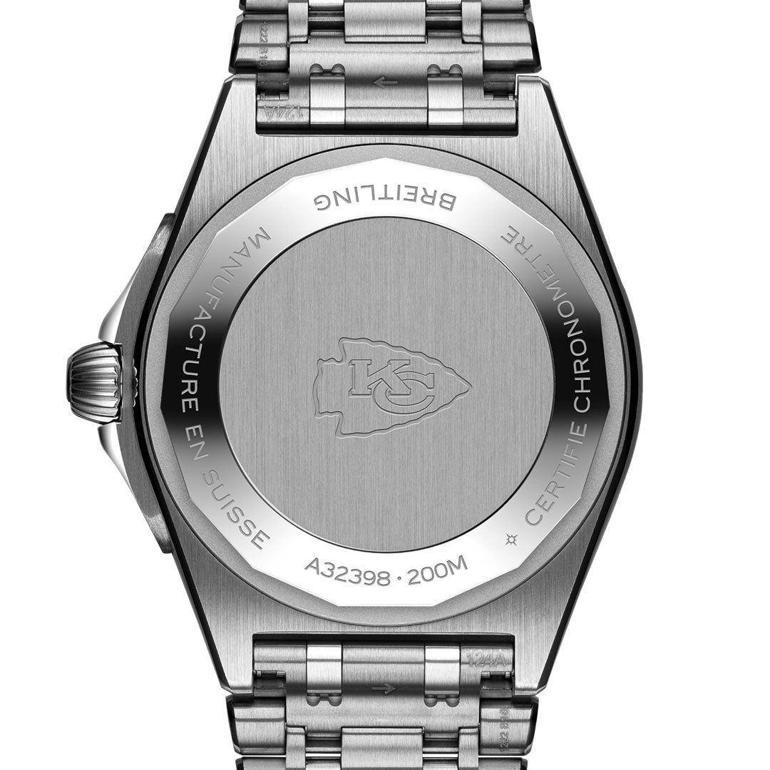A stainless steel BREITLING Chronomat Automatic GMT 40 watch back features the Kansas City Chiefs logo, with "MANUFACTURE EN SUISSE," "A32398," "200M," and "CERTIFIE CHRONOMETRE" engraved around the edge.