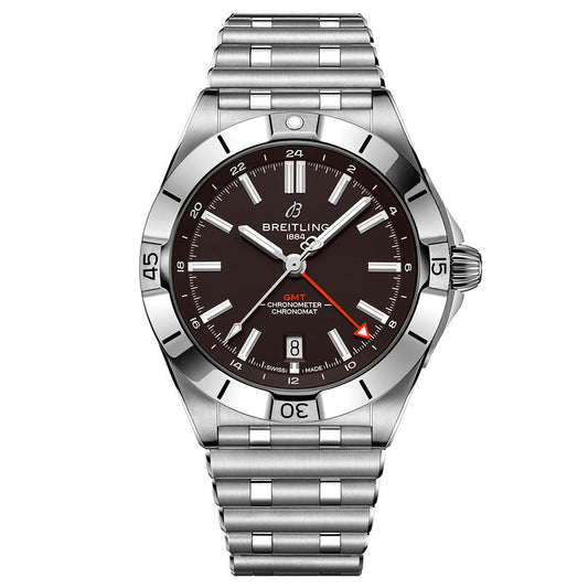 The BREITLING Chronomat Automatic GMT 40 features a stainless steel case, black dial, silver markers, red GMT hand, unidirectional bezel, date at 6 o’clock, and a silver link bracelet.