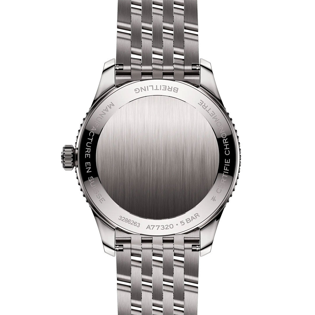 The back of the Breitling Navitimer 32 features a brushed stainless steel finish, engraved case text, and a metal link bracelet, showcasing Breitling’s iconic luxury craftsmanship.