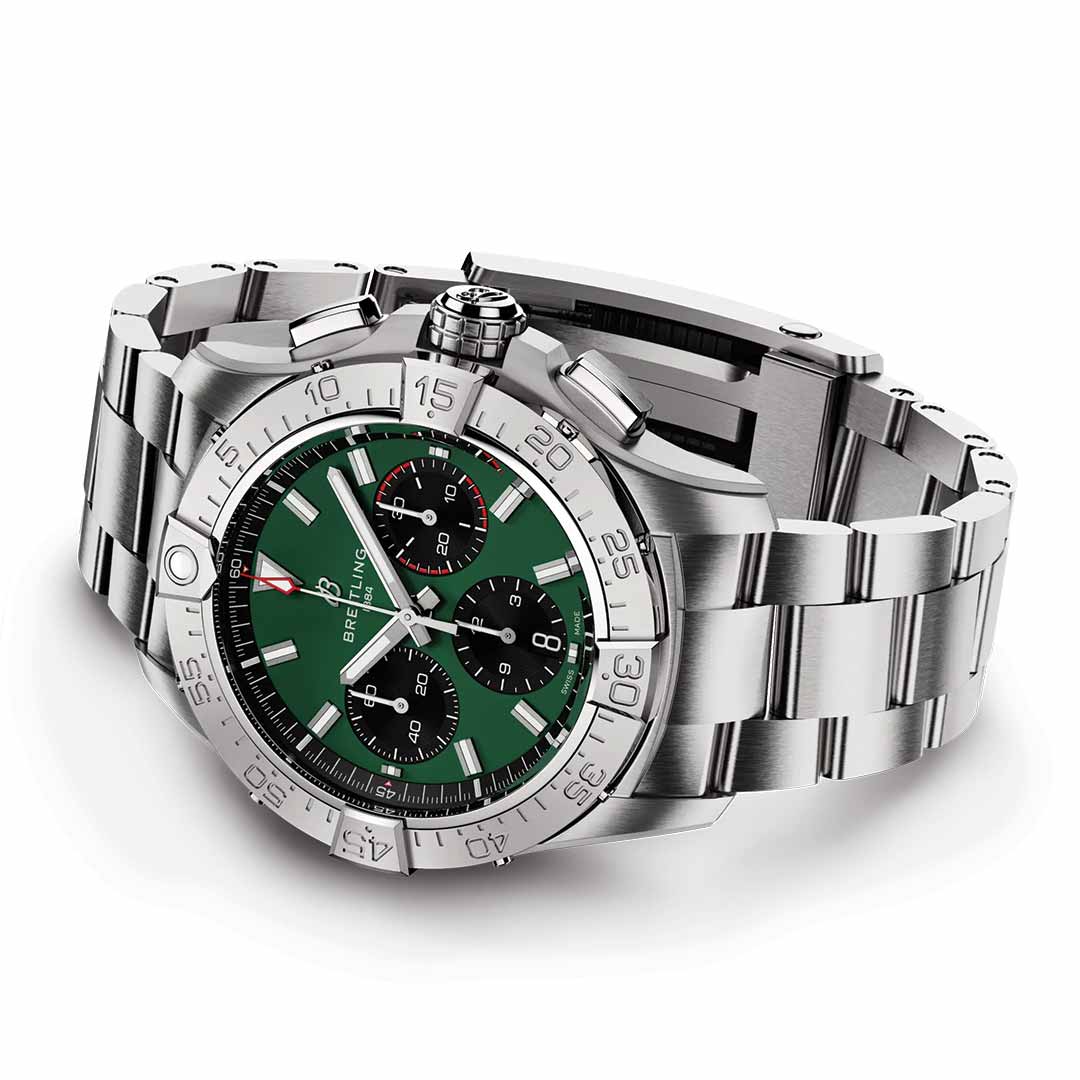 The BREITLING Avenger B01 Chronograph 42 wristwatch boasts a green dial with three black subdials, highlighting its aviation-inspired design. The bezel is numerically marked and paired with a metal link bracelet. The esteemed "Breitling" brand graces the dial, showcasing its storied heritage.