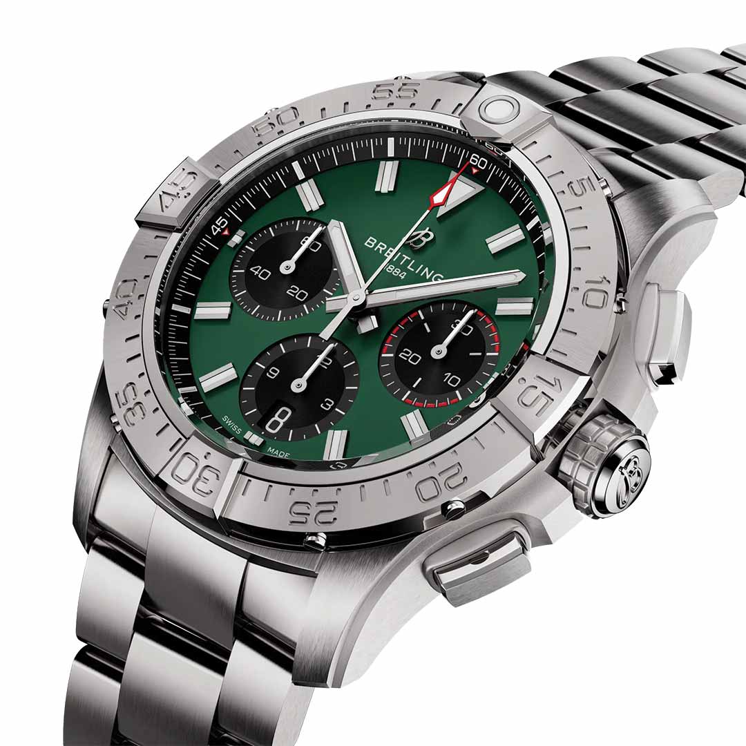 The BREITLING Avenger B01 Chronograph 42 expertly merges a sleek design with an aviation-inspired style. This timepiece features a stainless steel band and an eye-catching green dial, complemented by three black subdials, a date window, silver hour markers, an engraved numeral bezel, and a protective crown guard.