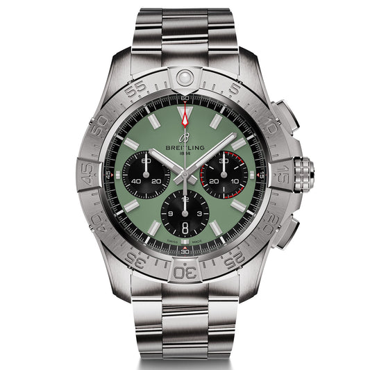 The BREITLING Avenger B01 Chronograph 44 by Breitling is a silver chronograph watch featuring a green dial, three black subdials, and a stainless steel bracelet. It has an engraved bezel with numbers, and its prominent pushers on the side enhance its full-throttle functionality.