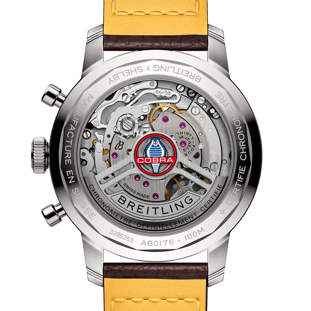The Breitling Top Time B01 Shelby Cobra features a see-through caseback revealing its mechanical gears and Shelby Cobra logo, paired with a yellow leather strap and engraved details for a bold, distinctive look.