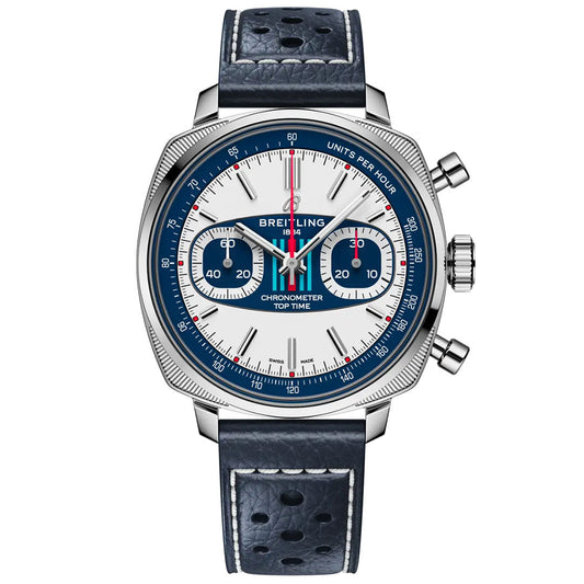 The Breitling Top Time B01 Racing chronograph features a white and blue Martini Racing dial, red second hand, two subdials, a blue perforated leather strap, and a stainless steel case with two pushers and crown on the right.